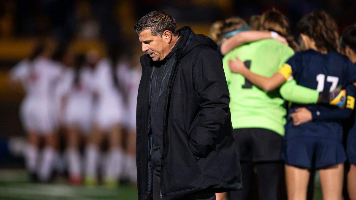 Oak Ridge Trojans’ head coach Rino Chimienti walks to the sideline after the end of overtime against the Buchanan Bears, bringing up penalty kicks, at the high school girls soccer CIF NorCal Division I championship game Saturday, March 5, 2022, at Oak Ridge High School in El Dorado Hills.
