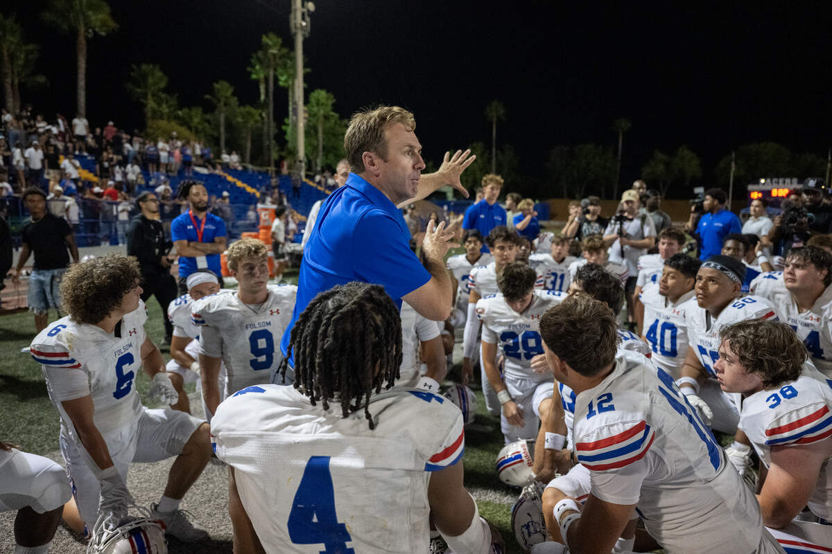 Folsom Bulldogs head coach Paul Doherty talks with his tea following the Bulldogs victory over the Grant Pacers in August in Del Paso Heights.