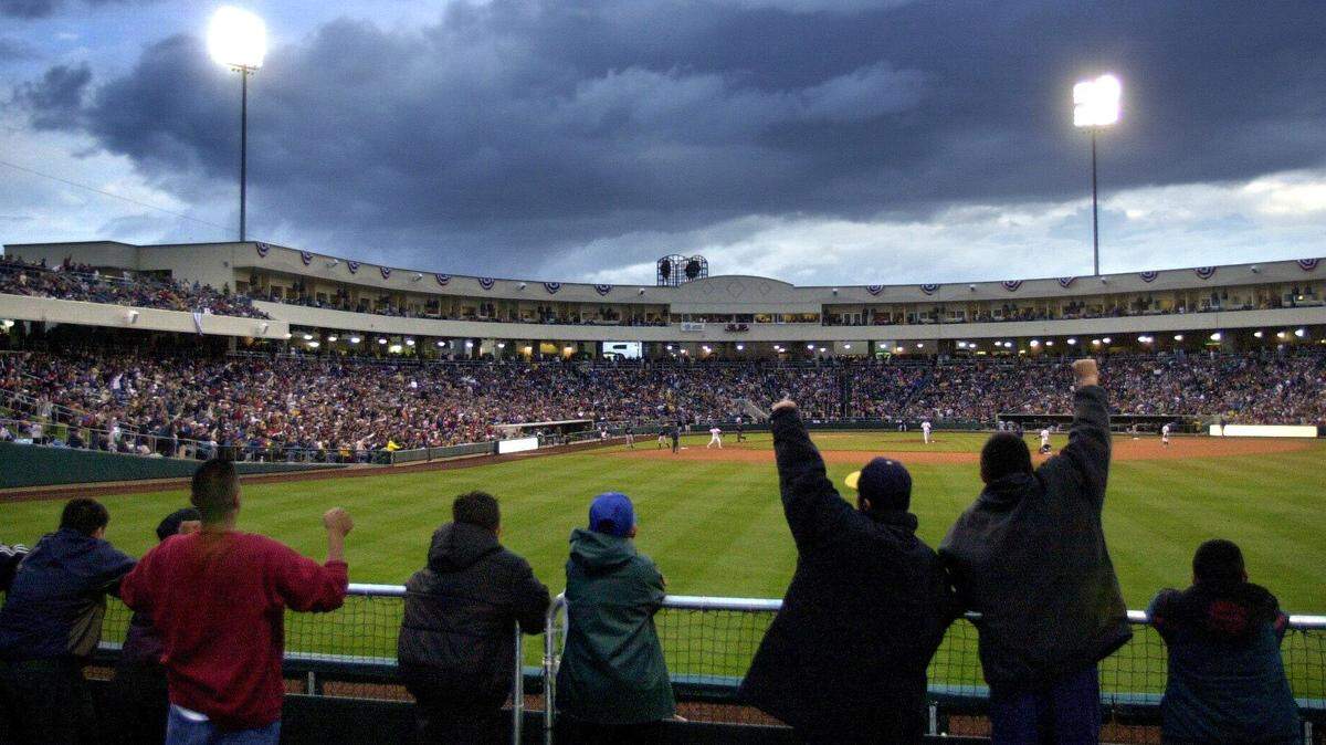 Fans cheer the first out that the River Cats made over the Edmonton Trappers during the first inning of the inaugural River Cats game at Raley Field on May 15, 2000, in West Sacramento.