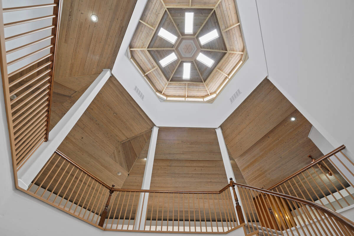 The high hexagonal ceiling lets natural light into the Fair Oaks Bluffs home on the American River.