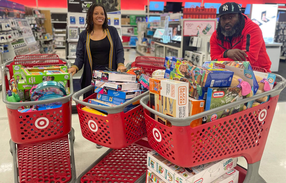 Sacramento Voice of the Youth coordinator Kayla Green and founder Berry Accius shop for gifts for the organization’s holiday drive.
