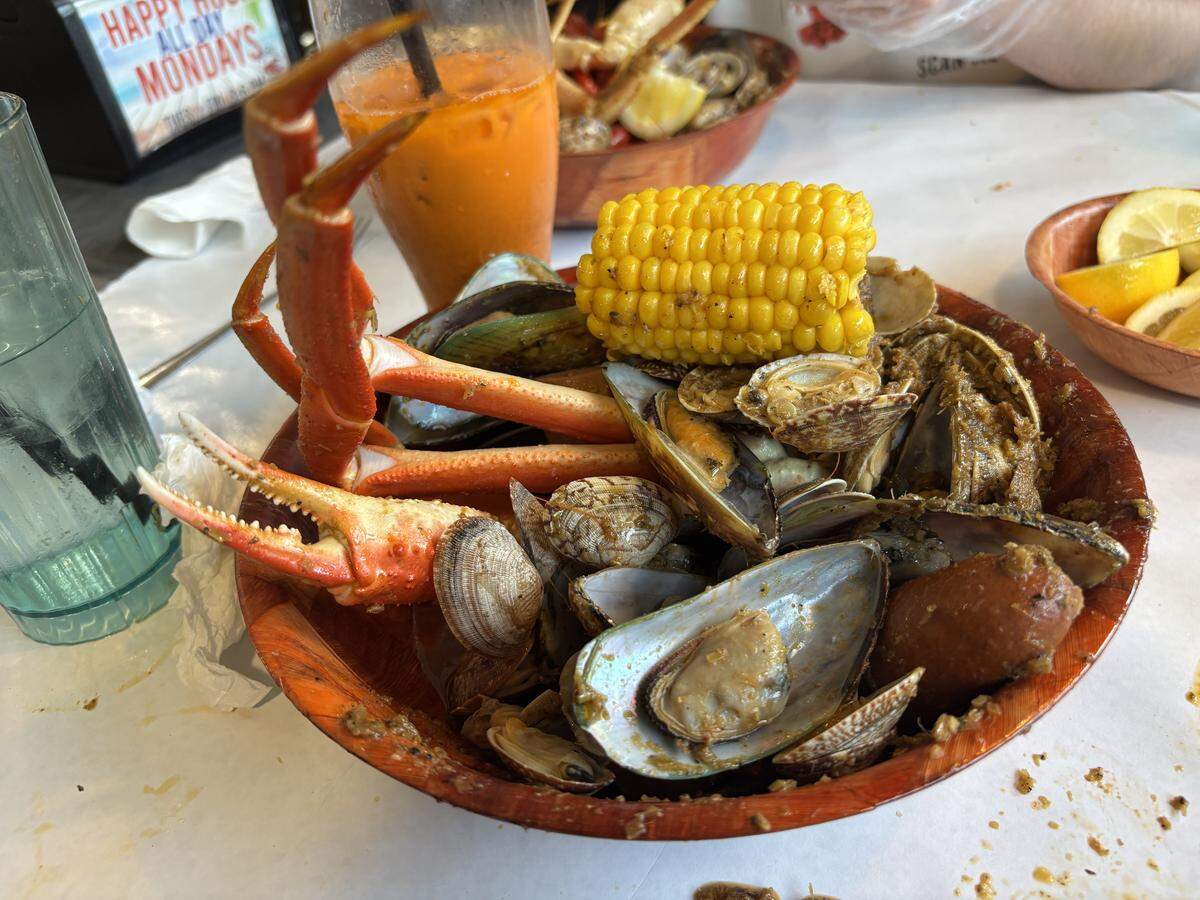 A bowl of seafood boil at Firehouse Crawfish is entirely customizable, from the seafood options to the spice blend and heat level. Snow crab legs, mussels, clams, sausage and corn came smothered in the restaurant’s Cajun garlic butter sauce, with an ample serving of lemons on the side.