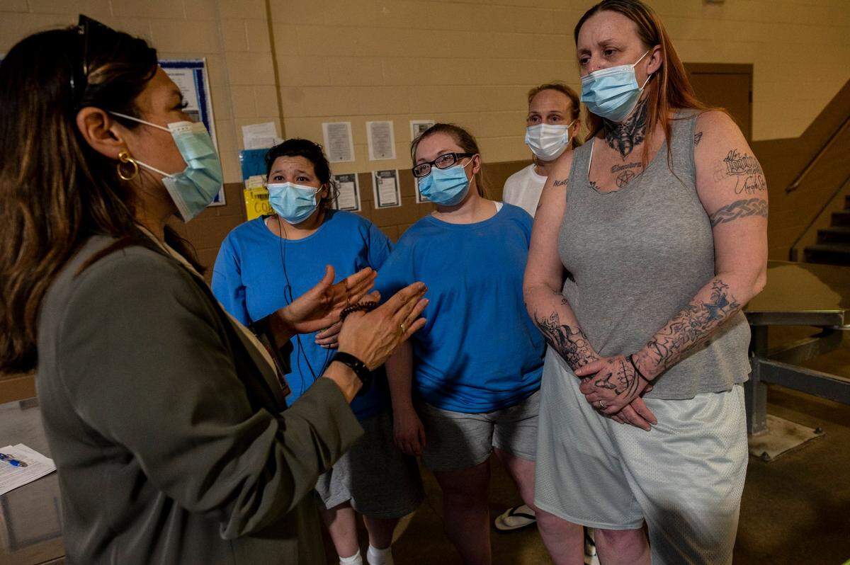 Norma Cumpian, left, chats with incarcerated women from left, Pauline Flores, Nicole Job, Lori Fries, and Carla Criswell at Folsom Women’s Facility in April. Cumpian is a champion for womens programs inside and outside of prison.