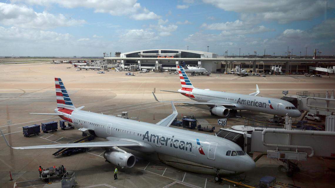 In this June 16, 2018, photo, American Airlines aircrafts are seen at Dallas-Fort Worth International Airport in Grapevine, Texas. Three Sacramento airport workers were arrested in July for stealing gift cards from mail transported by American Airlines planes.