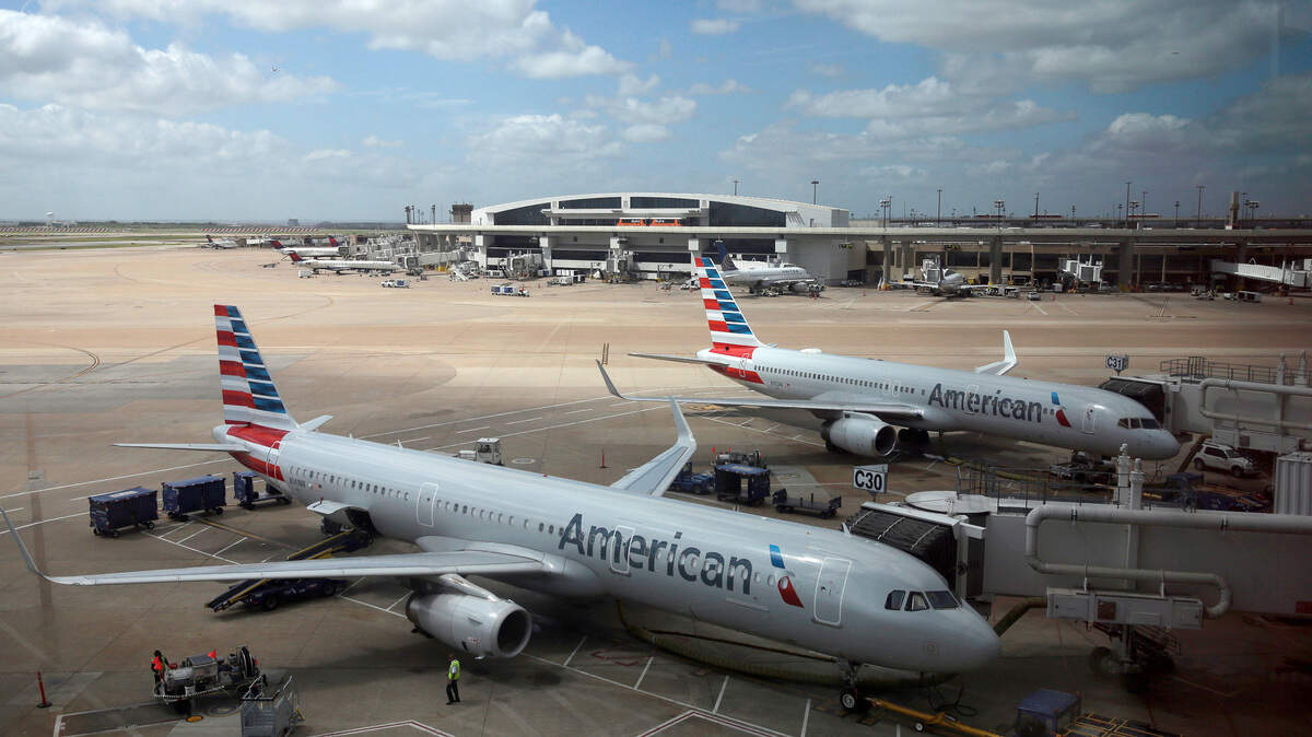 In this June 16, 2018, photo, American Airlines aircrafts are seen at Dallas-Fort Worth International Airport in Grapevine, Texas. Three Sacramento airport workers were arrested in July for stealing gift cards from mail transported by American Airlines planes.