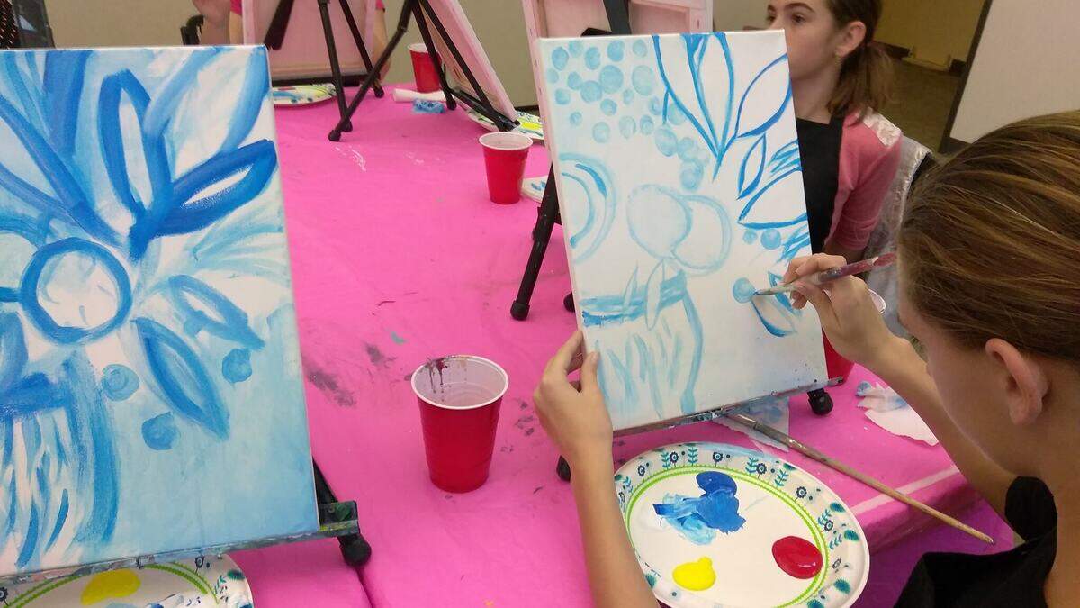 Girls work on a Girl Scout painting badge led by artist Deidre Trudeau. The project included all of the requirements for both brownies and juniors to obtain their badges at the Girl Scouts headquarters in Sacramento.