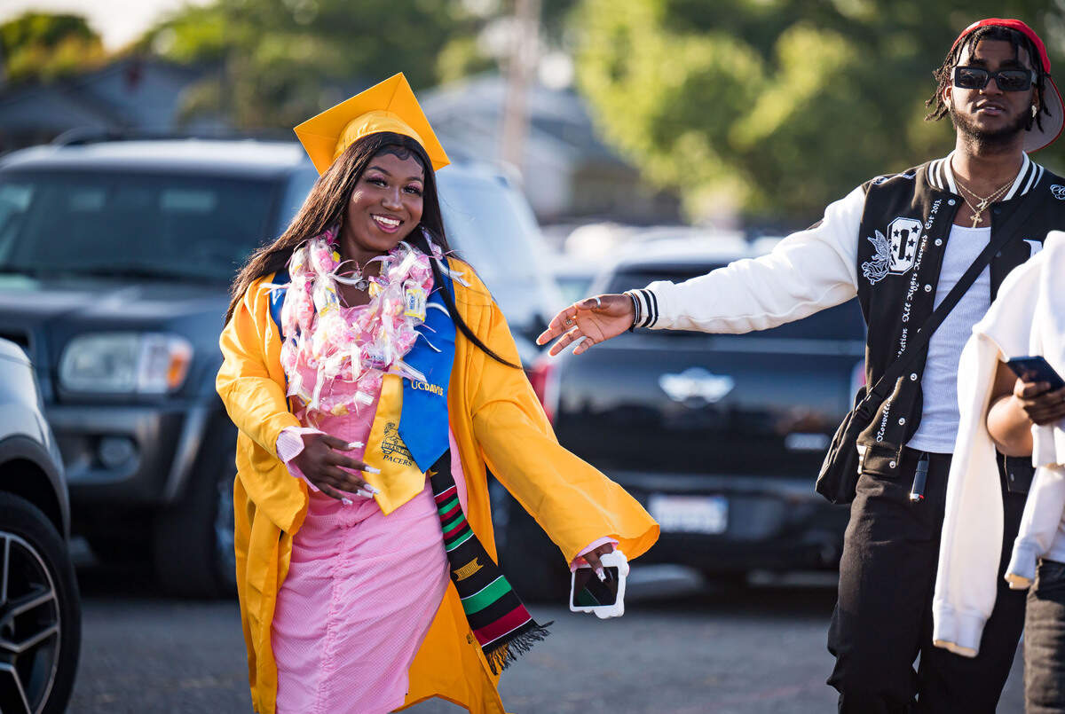 Katrise Farr, a Grant Union High School graduating senior, arrives before the start of the graduation ceremony Thursday, June 1, 2023, in Sacramento’s Del Paso Heights neighborhood.