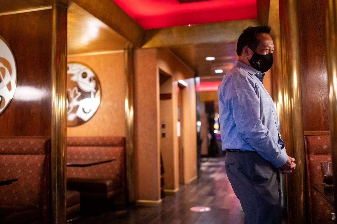 Kevin Fat, CEO of Fat Family Restaurant Group, talks with a party seated at a booth at Frank Fats on Friday, Oct. 30, 2020, in downtown Sacramento.