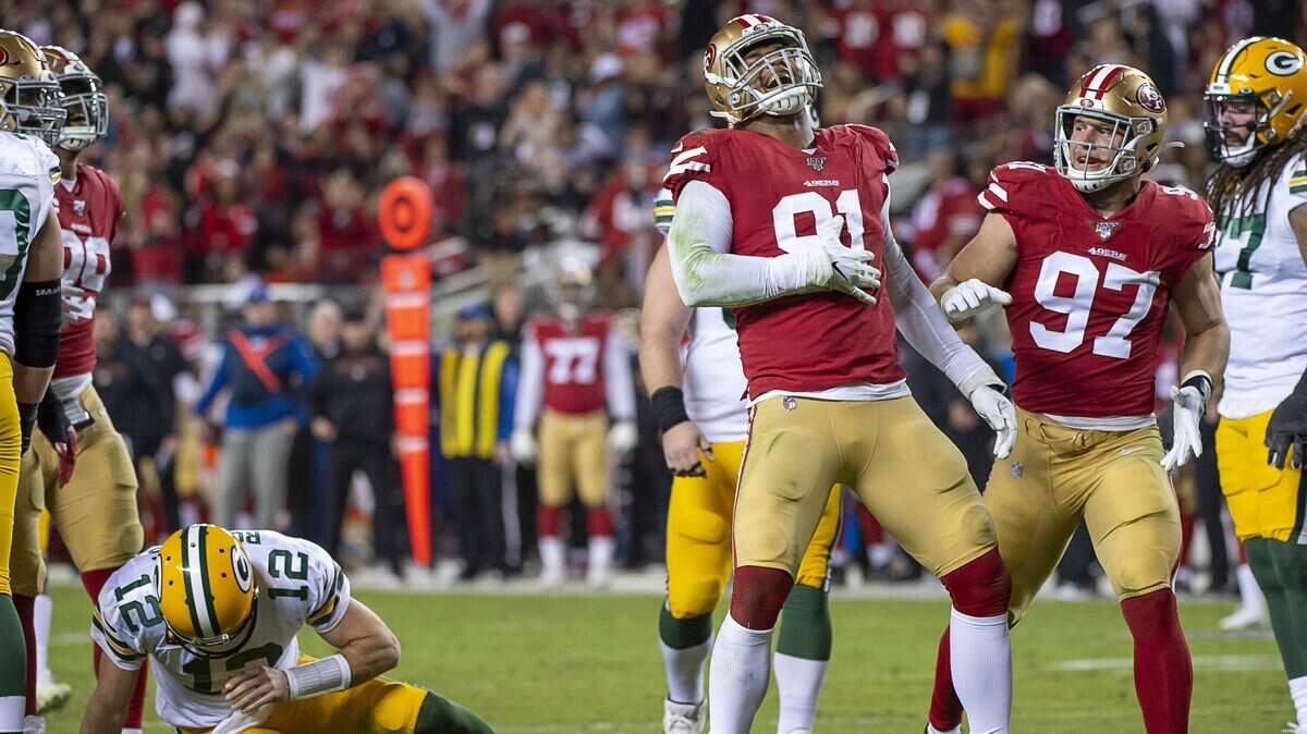 Arik Armstead celebrates after the 49ers’ defensive lineman sacked Green Bay Packers quarterback Aaron Rodgers on Sunday at Levi’s Stadium.