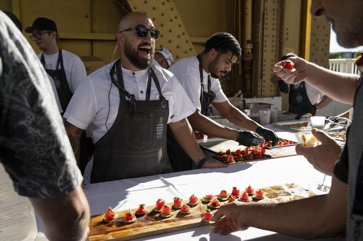 Guests at the Tower Bridge Dinner try an appetizer made from compressed watermelon on Sunday, Sept. 7, 2025.