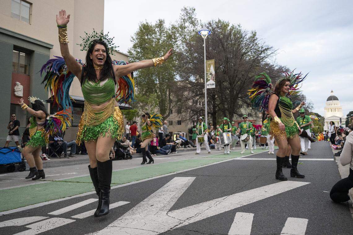 Members of the Samba Da Terra make their way down Capitol Mall during the City of Trees Parade in Sacramento on Saturday, Feb. 28, 2026.