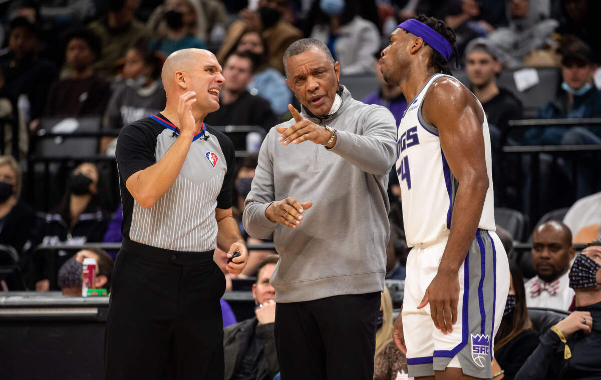Referee Jacyn Goble (68), left, reacts to protest by Sacramento Kings guard Buddy Hield (24), right, and Kings interim head coach Alvin Gentry after Hield was called for fouling Atlanta Hawks guard Delon Wright (0) on a jump shot in the fourth period at the NBA basketball game Wednesday, Jan. 5, 2022, at Golden 1 Center in Sacramento.
