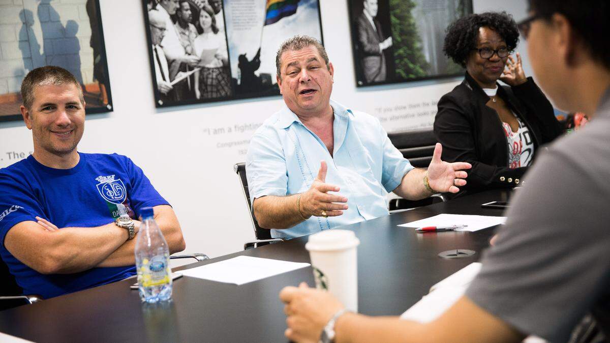 Eric Bauman, center, chair of the California Democratic Party, leads a staff meeting in Sacramento on Aug. 4, 2017. Bauman is facing sexual harassment allegations.