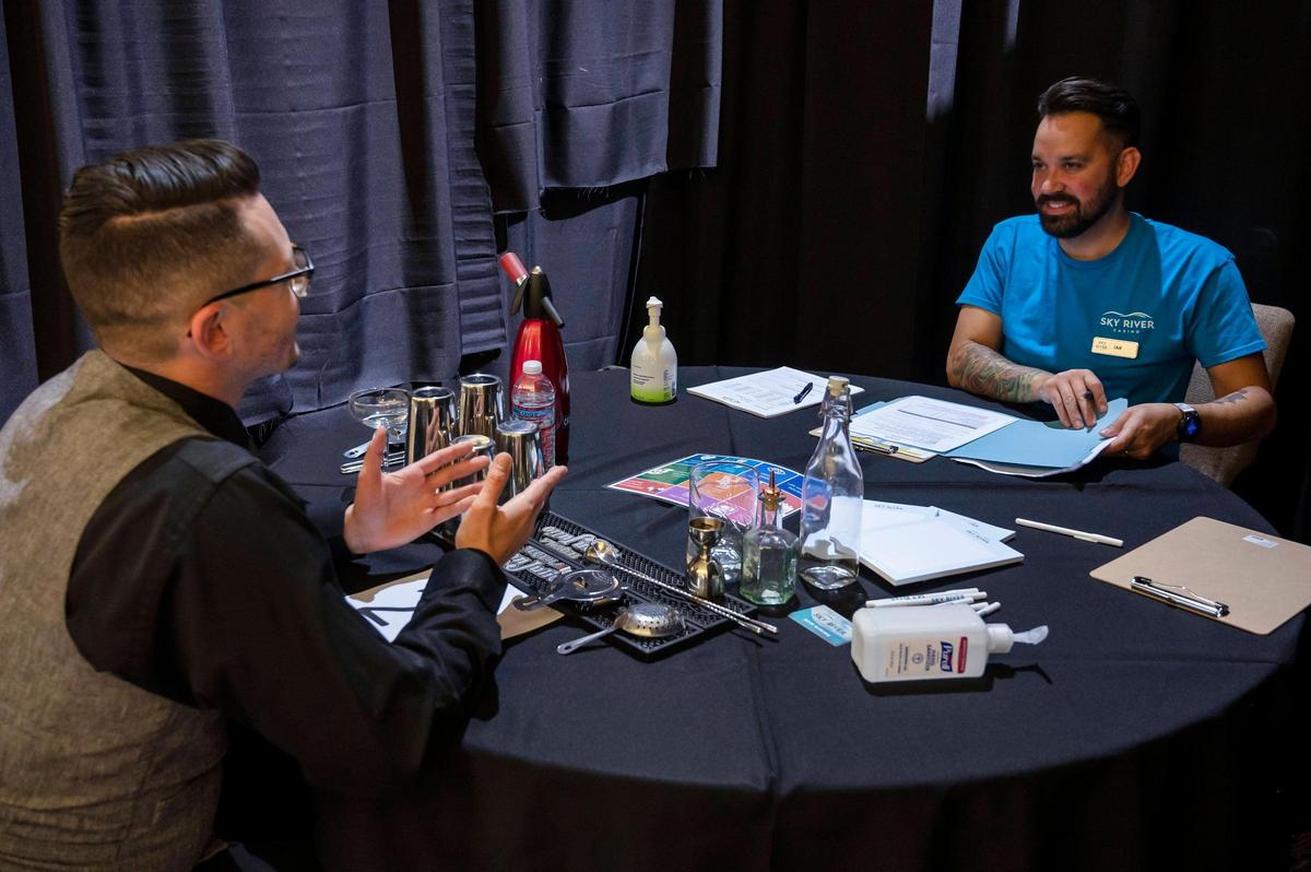 Ian Beightler, right, beverage manager, interviews Max Tapia during the job fair for the Sky River Casino on Monday, May 9, 2022, at the Rocklin Events Center. The $500 million casino in Elk Grove, developed by the Wilton Rancheria, is expected to employ as many as 2,000 workers.