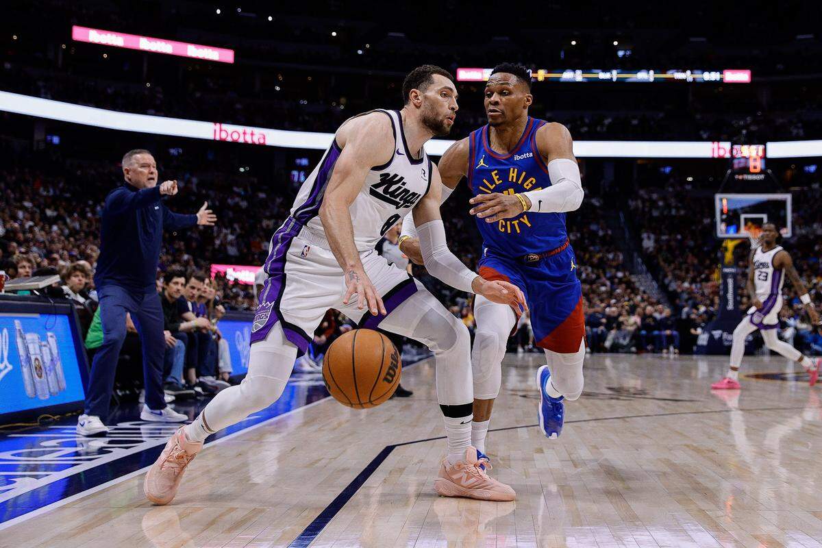 Mar 5, 2025; Denver, Colorado, USA; Sacramento Kings guard Zach LaVine (8) controls the ball under pressure from Denver Nuggets guard Russell Westbrook (4) in the fourth quarter at Ball Arena. Mandatory Credit: Isaiah J. Downing-Imagn Images
