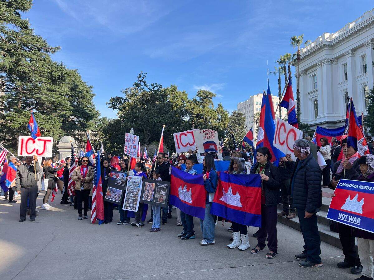 Rally attendees hold up the Cambodian flag at the California Capitol on Sunday, Jan. 11, 2026. Hundreds of people called for peace amid Cambodia and Thailand’s border dispute.