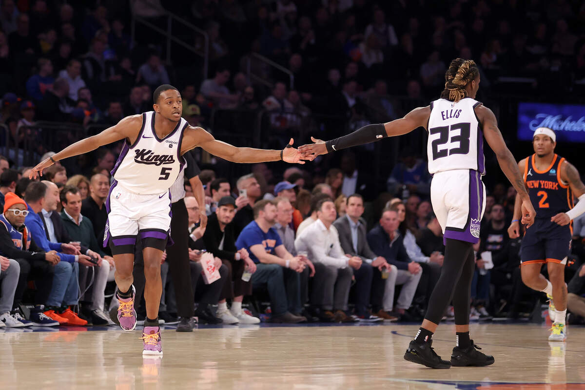 Sacramento Kings guard De’Aaron Fox (5) celebrates his 3-point shot against the New York Knicks with guard Keon Ellis (23) during the first quarter Thursday, April 4, 2024, at Madison Square Garden in New York.