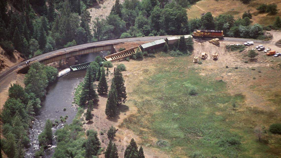 This July 15, 1991, Sacramento Bee photo shows an aerial view of the Southern Pacific tracks near Dunsmuir, CA, where a derailment toppled cars transporting a highly toxic chemical into the Sacramento River. The chemical, a weed killer, destroyed all vegetation and life forms downstream as far as Shasta Reservoir. On Friday, a train derailed near the site but there was no chemical spill.