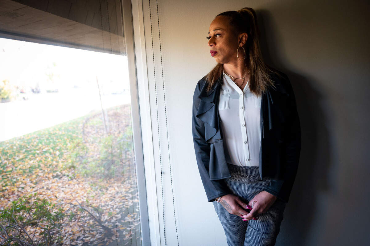 Jade looks out a window at the Volunteers of America’s offices in Sacramento earlier this month. She lives at a small shelter run by VOA through a program called Open Arms that serves individuals who are HIV-positive or living with AIDS.