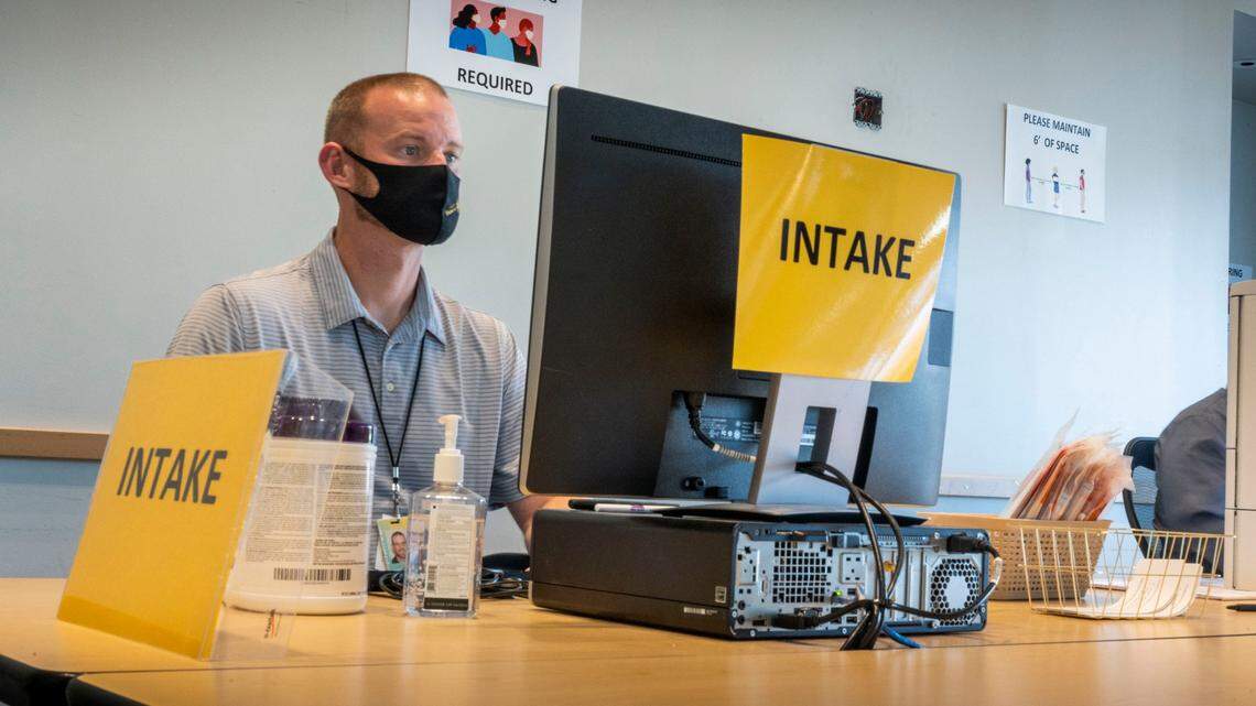 Chris Terry, a supervisor at the Franchise Tax Board offices on Butterfield Way near Rancho Cordova, waits to distribute COVID-19 test kits to employees on Thursday, Oct. 14, 2021. In the last three weeks, 137 employees tested positive for the virus.