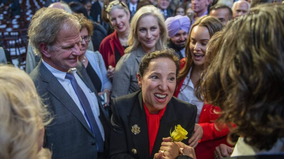 California Lt. Gov. Eleni Kounalakis holds a rose she was given after her swearing in ceremony at the Tsakopoulos Library Galleria on Monday, Jan. 7, 2019 in Sacramento.