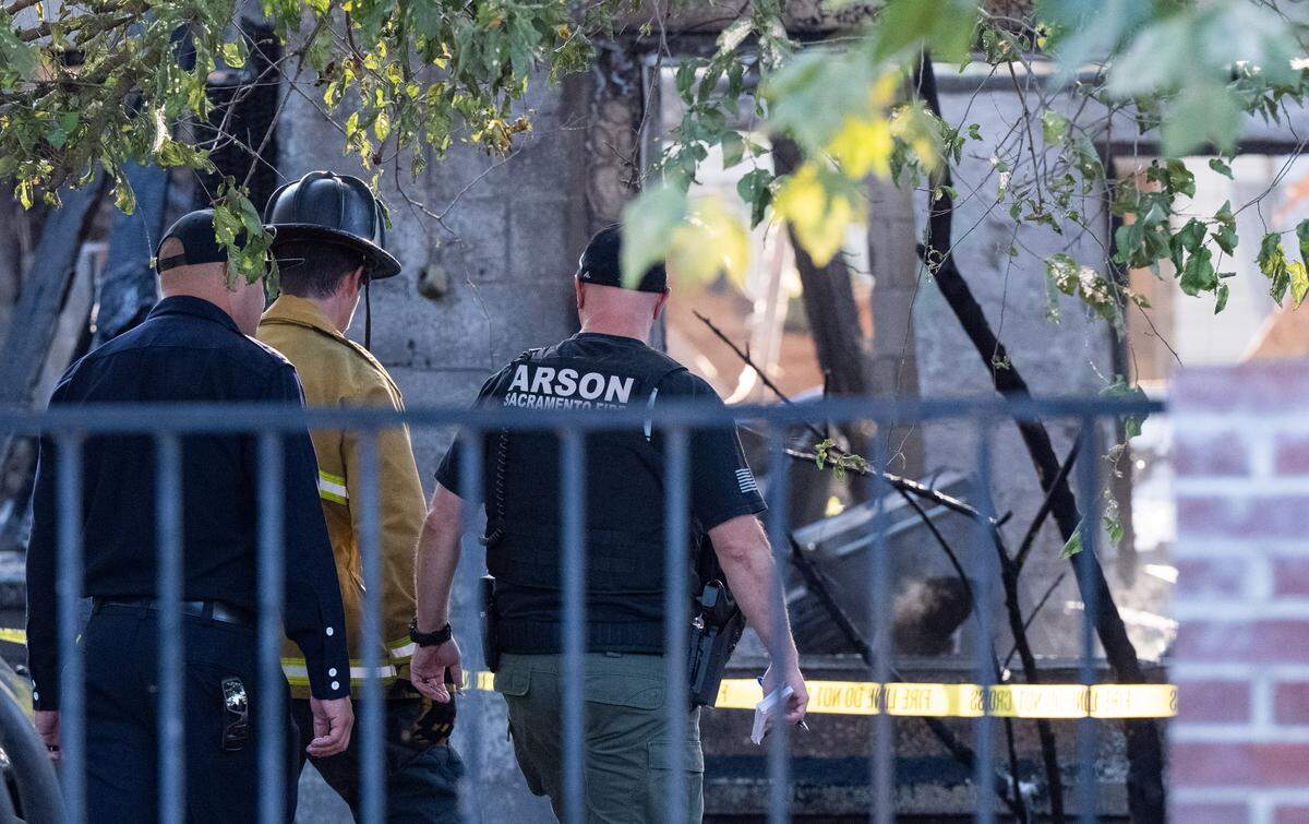 Sacramento firefighters investigate a home on 39th Street in Oak Park that was destroyed by an explosion and fire on Thursday, Aug. 21, 2025. One person was killed in the incident.
