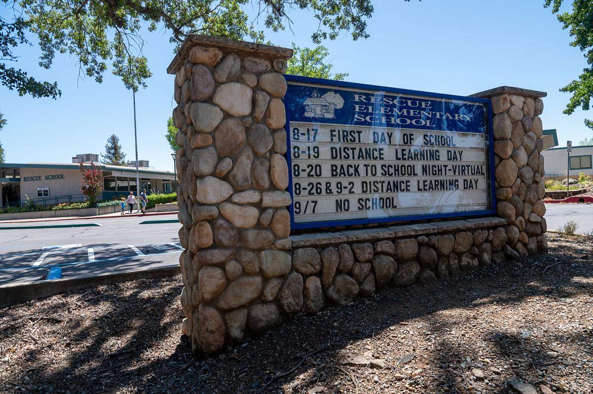 The sign in front Rescue Elementary School on Wednesday, Aug. 12, 2020, shows the school’s upcoming opening date on Monday when students will return to in-class instruction as well as several planned “distance learning days.”