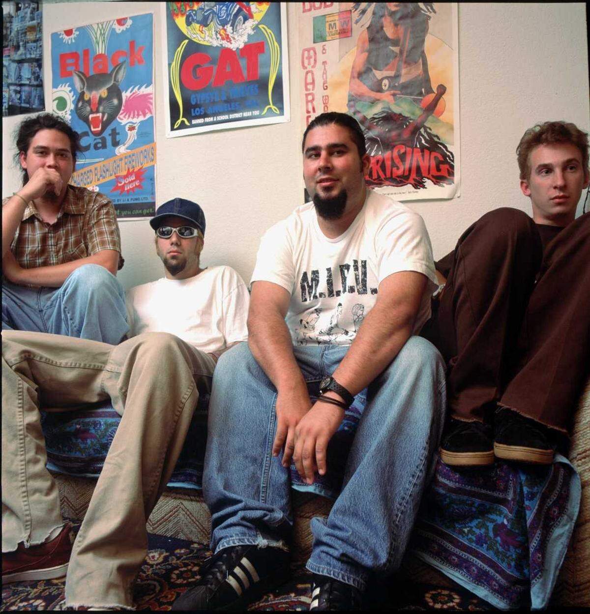 The Deftones hang out in singer Chino Moreno’s midtown Sacramento apartment in 1995 after the release of their first album. The original members of the Sacramento thrash-metal band were, from left, bassist Chi Cheng (who died in 2013), Moreno, guitarist Stephen Carpenter and drummer Abe Cunningham.
