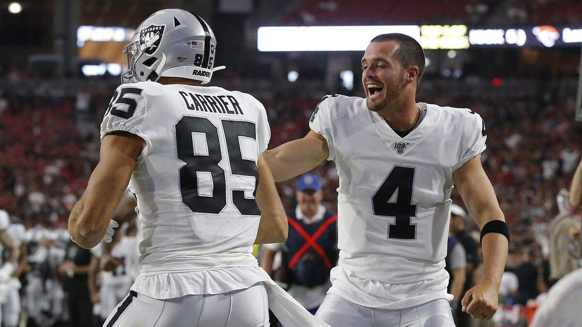Oakland tight end Derek Carrier celebrates his touchdown with quarterback Derek Carr.