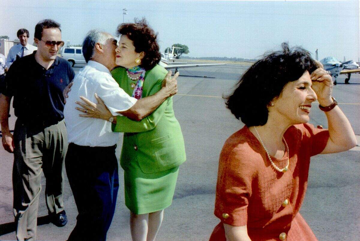 Democratic U.S. Senate Candidate Dianne Feinstein is greeted by capital developer Angelo Tsakopoulos and his nephew Sotiris Kolokotronis on June 4, 1992, as she and fellow Democratic U.S. Senate hopeful Barbara Boxer arrive at Sacramento Metropolitan Airport.