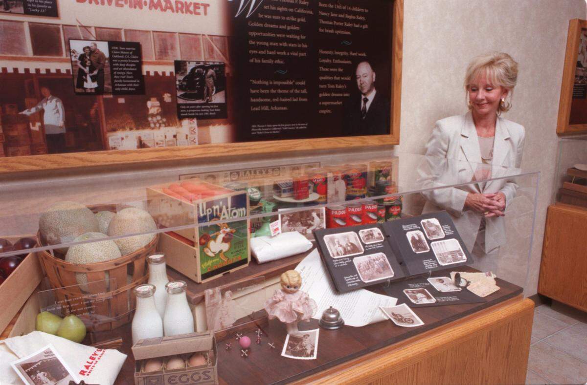Joyce Raley Teel stands next to the Thomas P. Raley historical exhibit at the Raley’s corporate headquartes in West Sacramento in 1997.