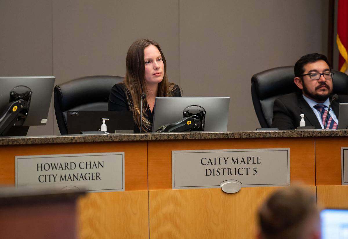 Newly elected Sacramento City Councilwoman Caity Maple, center, listens to public comment Tuesday, Feb. 14, 2023, during a Sacramento City Council meeting at City Hall where activists criticized the recent vote to purchase a Rook for the police department. Maple, who represents Oak Park, and new Councilwoman Karina Talamantes, who represents South Natomas, have received a lot of criticism for supporting the purchase.