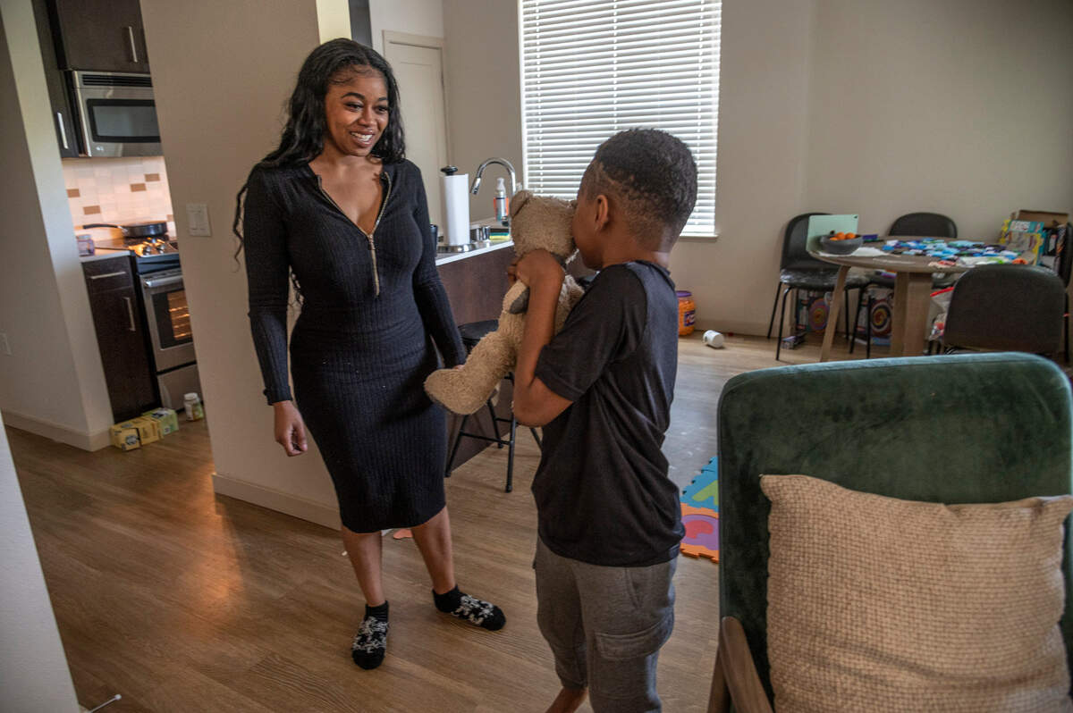 Allexis Holmes smiles at her son in their Sacramento-area apartment on Thursday, March 24, 2022. Allexis is suing her ex-husband, Kings forward Richaun Holmes, in separate custody and domestic violence cases.