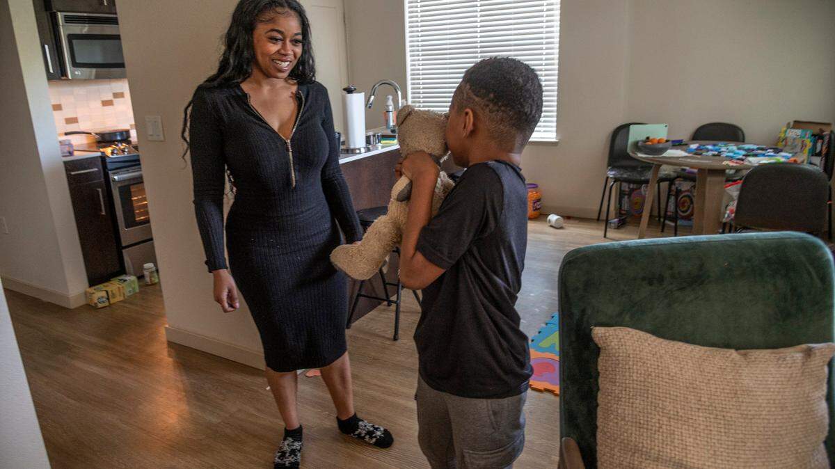 Allexis Holmes smiles at her son in their Sacramento-area apartment on Thursday, March 24, 2022. Allexis is suing her ex-husband, Kings forward Richaun Holmes, in separate custody and domestic violence cases.
