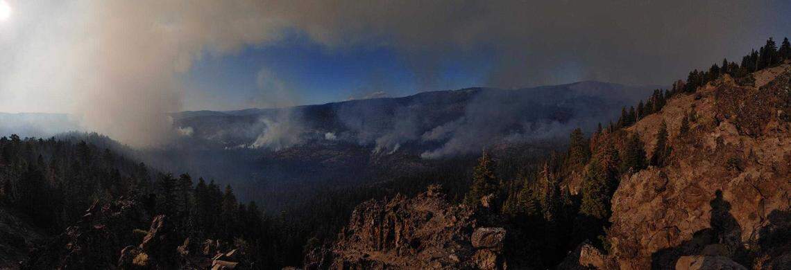 Smoke is seen rising from the Caples Fire in the Eldorado National Forest in El Dorado County on Oct. 9, 2019. The Caples Fire started as a prescribed burn Sept. 30 to reduce fuel and create defensible space. But when winds changed, rapidly pushing flames south and west, officials declared it a wildfire to obtain additional fire fighting resources.