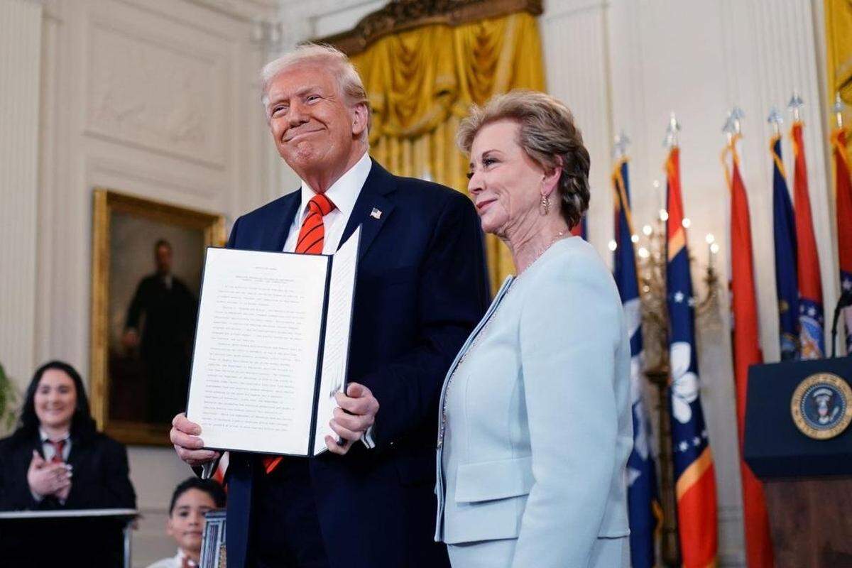 President Donald Trump stands with Education Secretary Linda McMahon after signing an executive order to dismantle the Department of Education at the White House in Washington, D.C., in March.