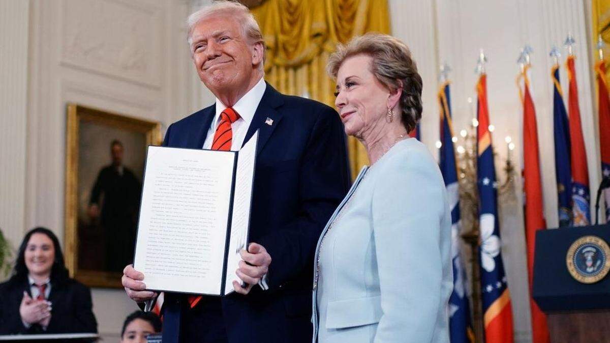President Donald Trump stands with Education Secretary Linda McMahon after signing an executive order to dismantle the Department of Education at the White House in Washington, D.C., in March.