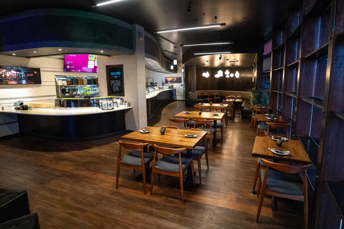 The back dining room features a sushi bar and family-focused dining area.