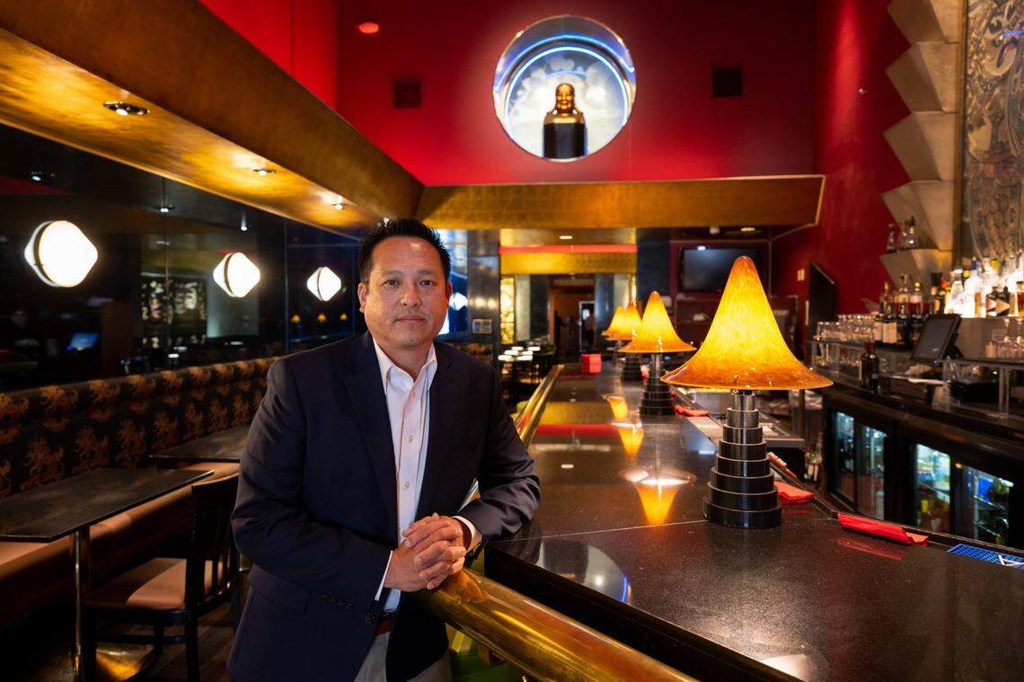 Kevin Fat, CEO of the Fat Family Restaurant Group, stands in May at the bar in Frank Fat’s, the restaurant his grandfather opened in 1939. Fat helped create a process to create a socio-cultural exemption from Sacramento’s ban on gas service to new buildings.