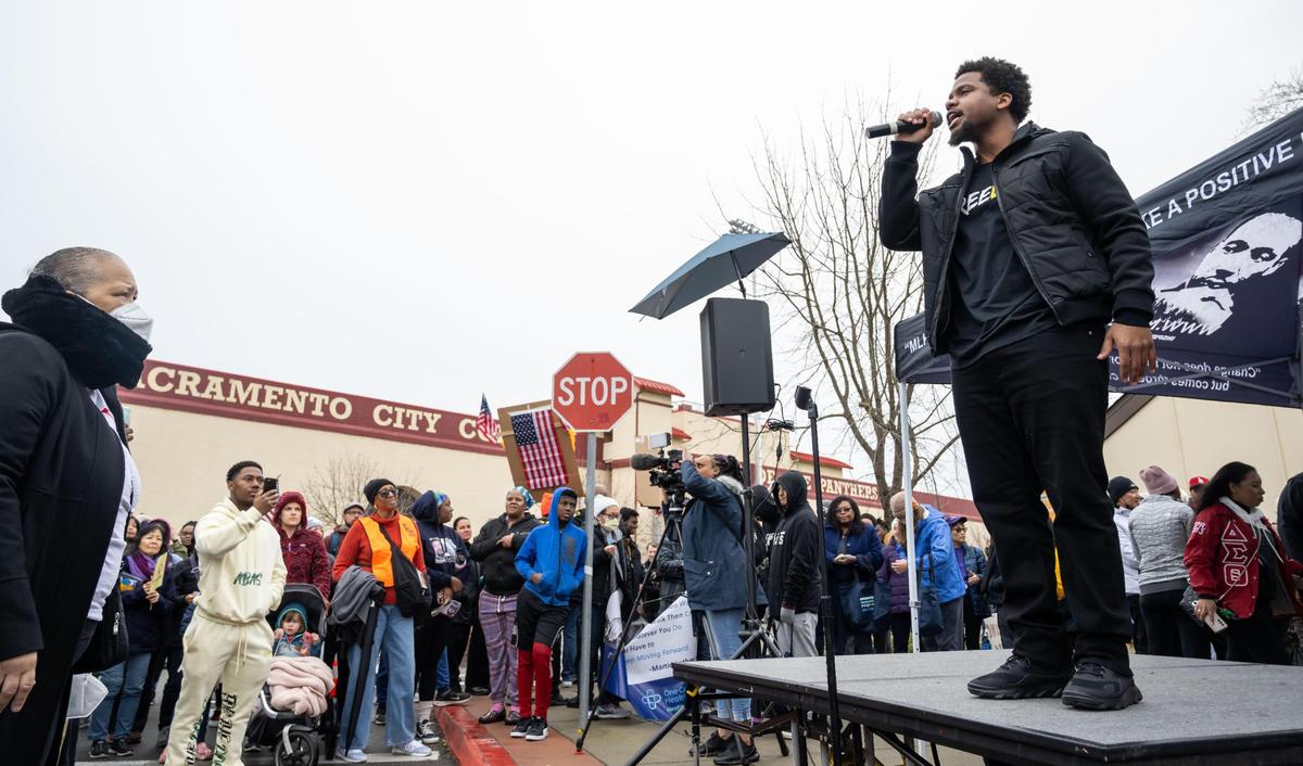 Hip-hop artist and educator DeWayne Ewing Jr., who goes by Consci8us on stage, encourages audience participation during his song “Freedom” moments before the crowd of thousands set out from Sacramento City College on Monday, Jan. 16, 2023, for the MLK365 March for the Dream honoring Martin Luther King Jr. “I actually performed it for the first time during the 50th year anniversary of Dr. Martin Luther King’s birthday, for the MLK march back in 2018, and then I’ve been performing it every year since,” Ewing said.