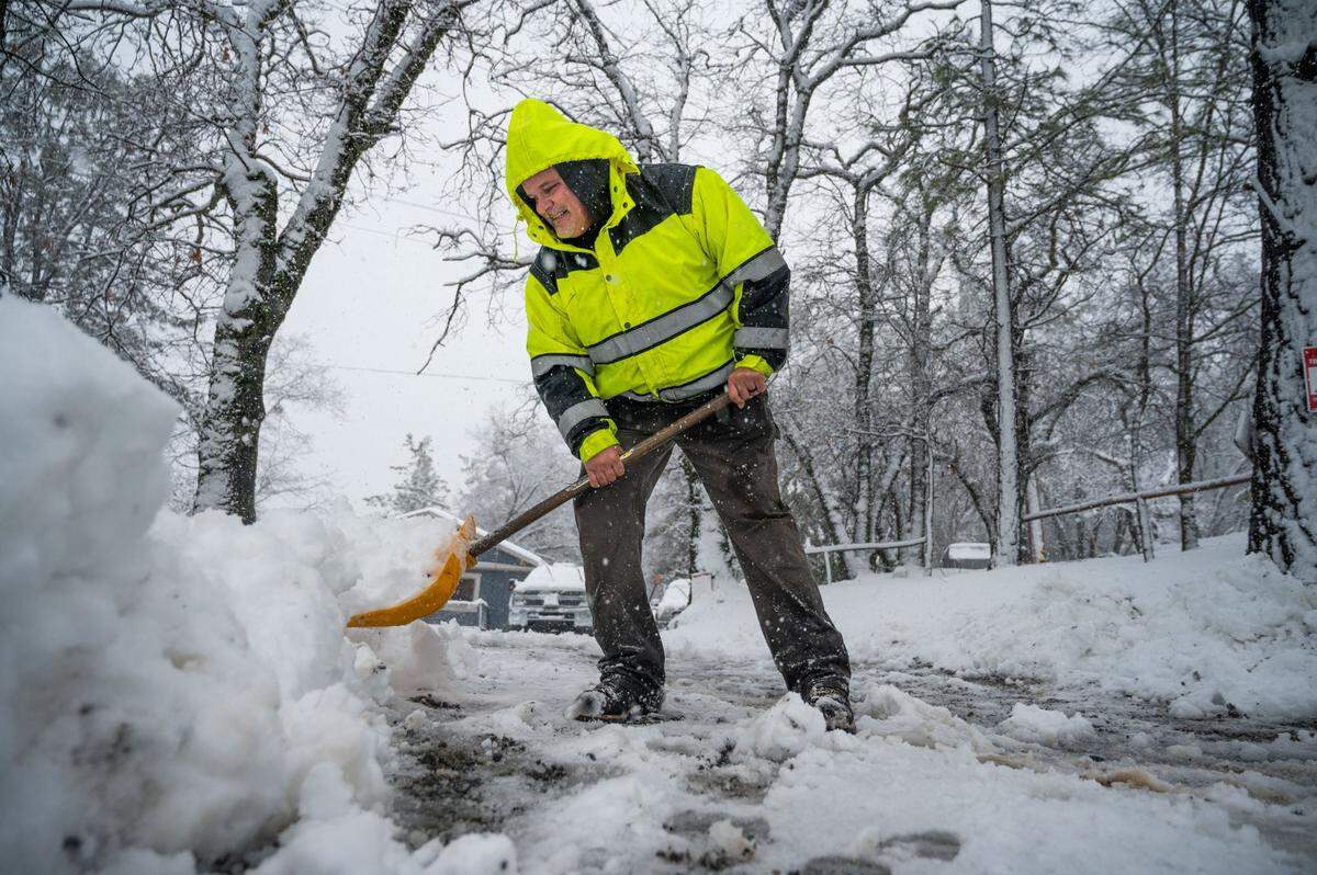 Hayes Condon shovels snow in his driveway on Tuesday in Colfax.