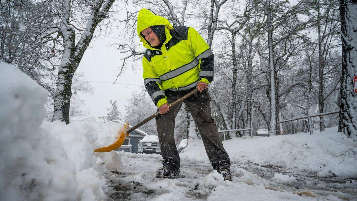 Hayes Condon shovels snow in his driveway on Tuesday, Feb. 28, 2023, in Colfax.