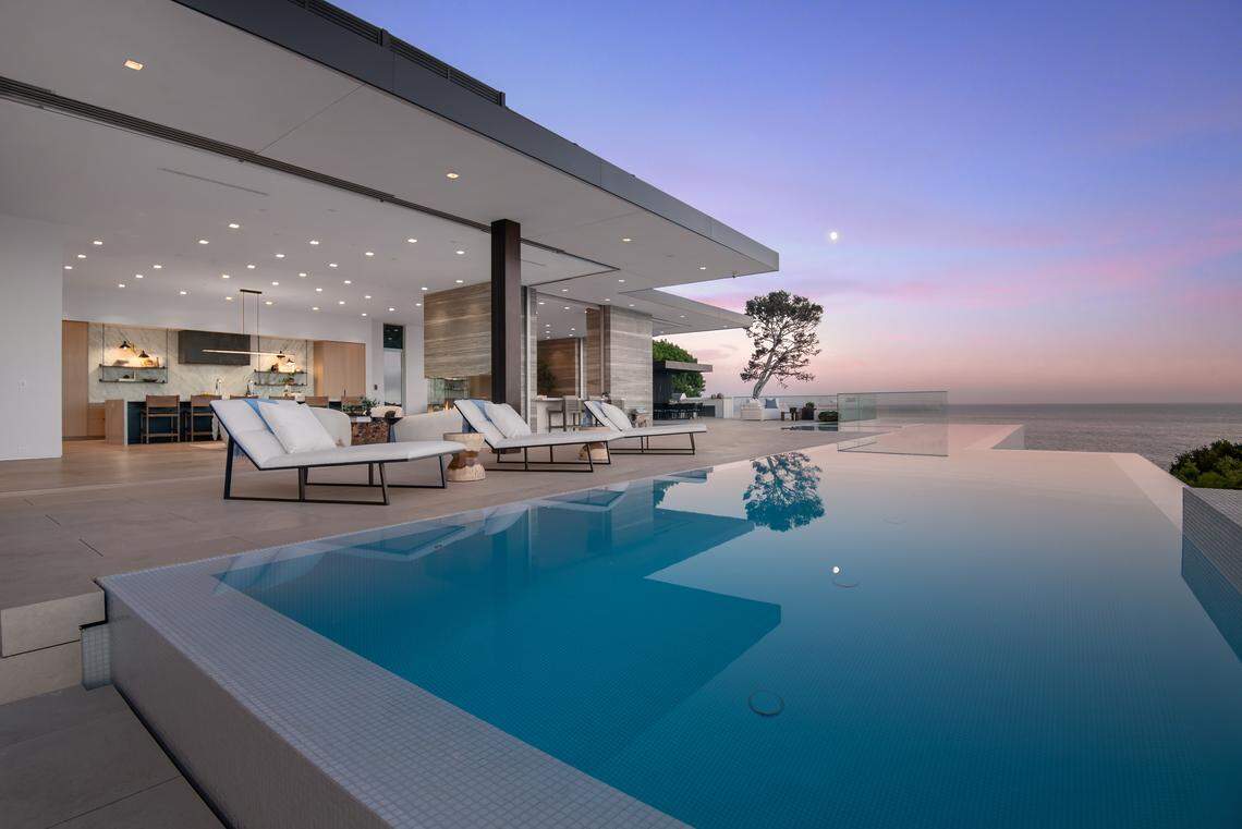 The dramatic zero-edge infinity pool offers a front row seat to Malibu’s sunsets.