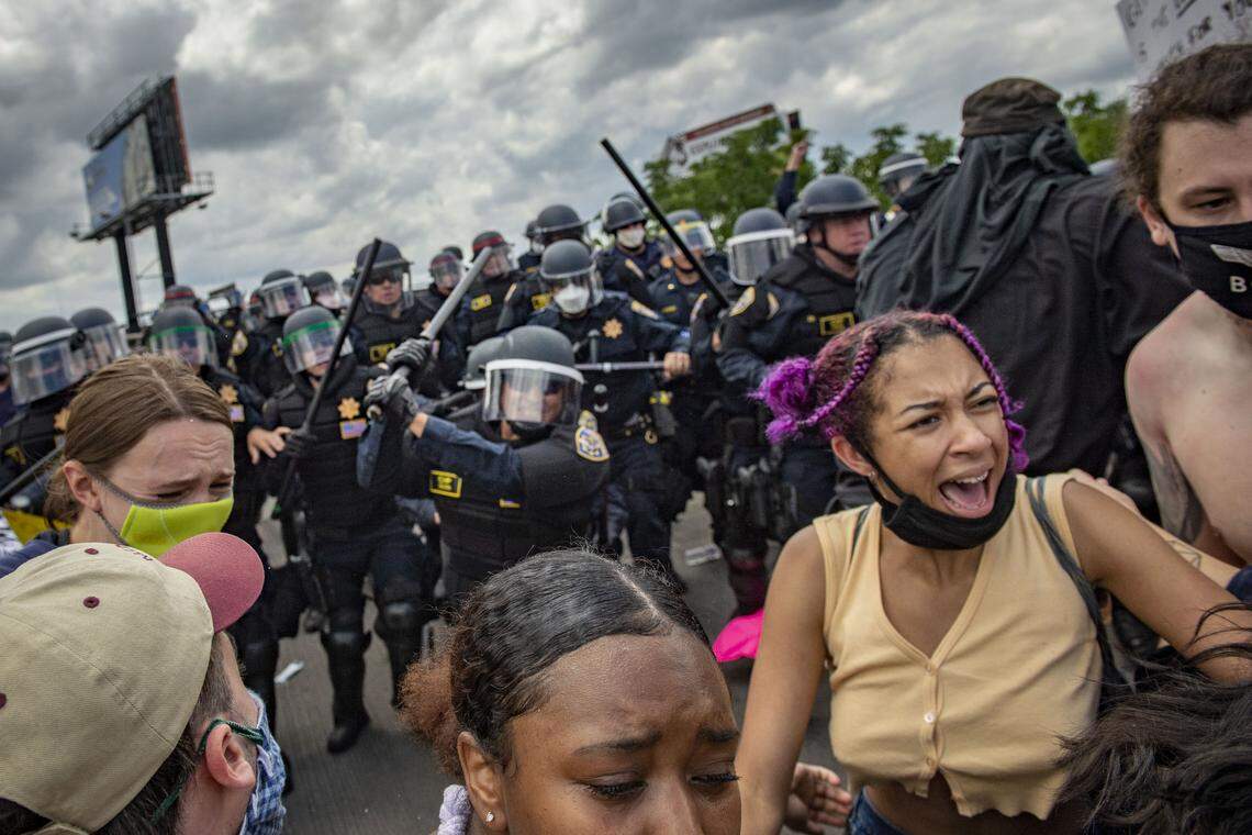 Protesters flee CHP officers after tensions between the two groups escalated briefly Saturday, May 30, 2020, on the 5th Street off ramp on Interstate 80 in West Sacramento. Protests and riots have erupted around the country after the death of George Floyd at the hands of a police officer in Minneapolis, Minnesota.
