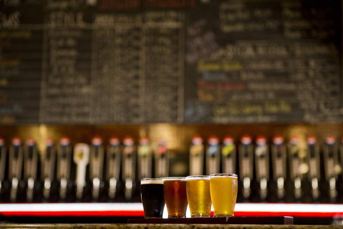 A sampler tray stands in front of the beer board at the New Glory Brewery. IPAs are the best selling style of craft beer in the country, but stouts have the critical acclaim in Sacramento.