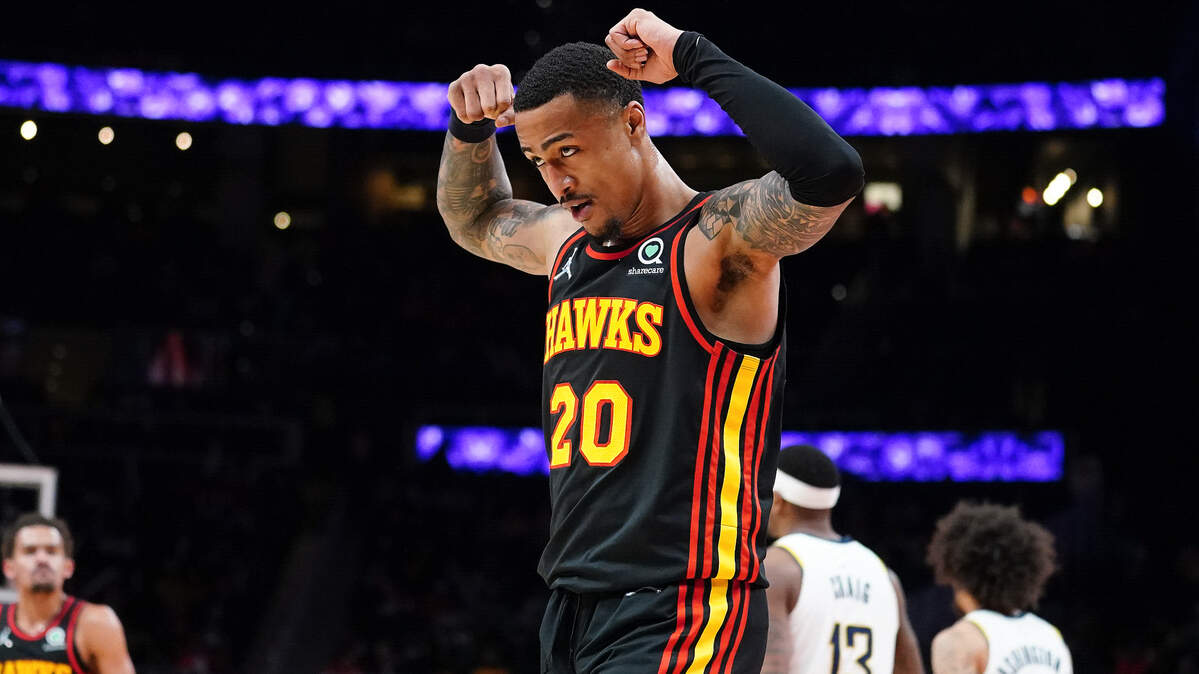 Atlanta Hawks forward John Collins (20) gestures after a dunk during the first half against the Indiana Pacers in an NBA basketball game Tuesday, Feb. 8, 2022, in Atlanta. (AP Photo/John Bazemore)