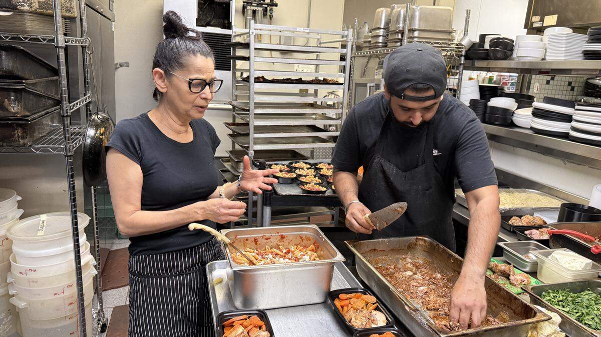 Todo Un Poco’s Marie Mertz and Ninda Soomal prepare meals from dontated foods on Saturday, March 21. They are made as part of a pilot program with the Capital Food Access Alliance. The meals are donated to the Rancho Cordova Food Bank three times weekly.