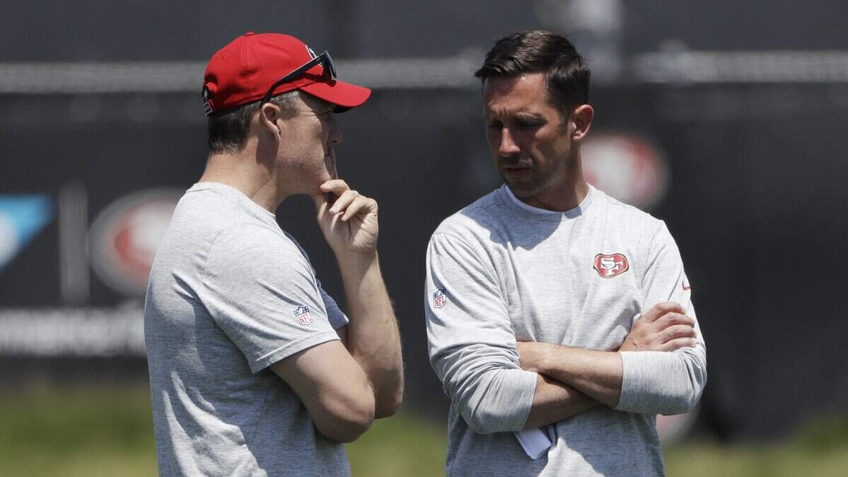 San Francisco 49ers general manager John Lynch, left, and coach Kyle Shanahan largely kept the scouting department from the previous regime intact when they took over.