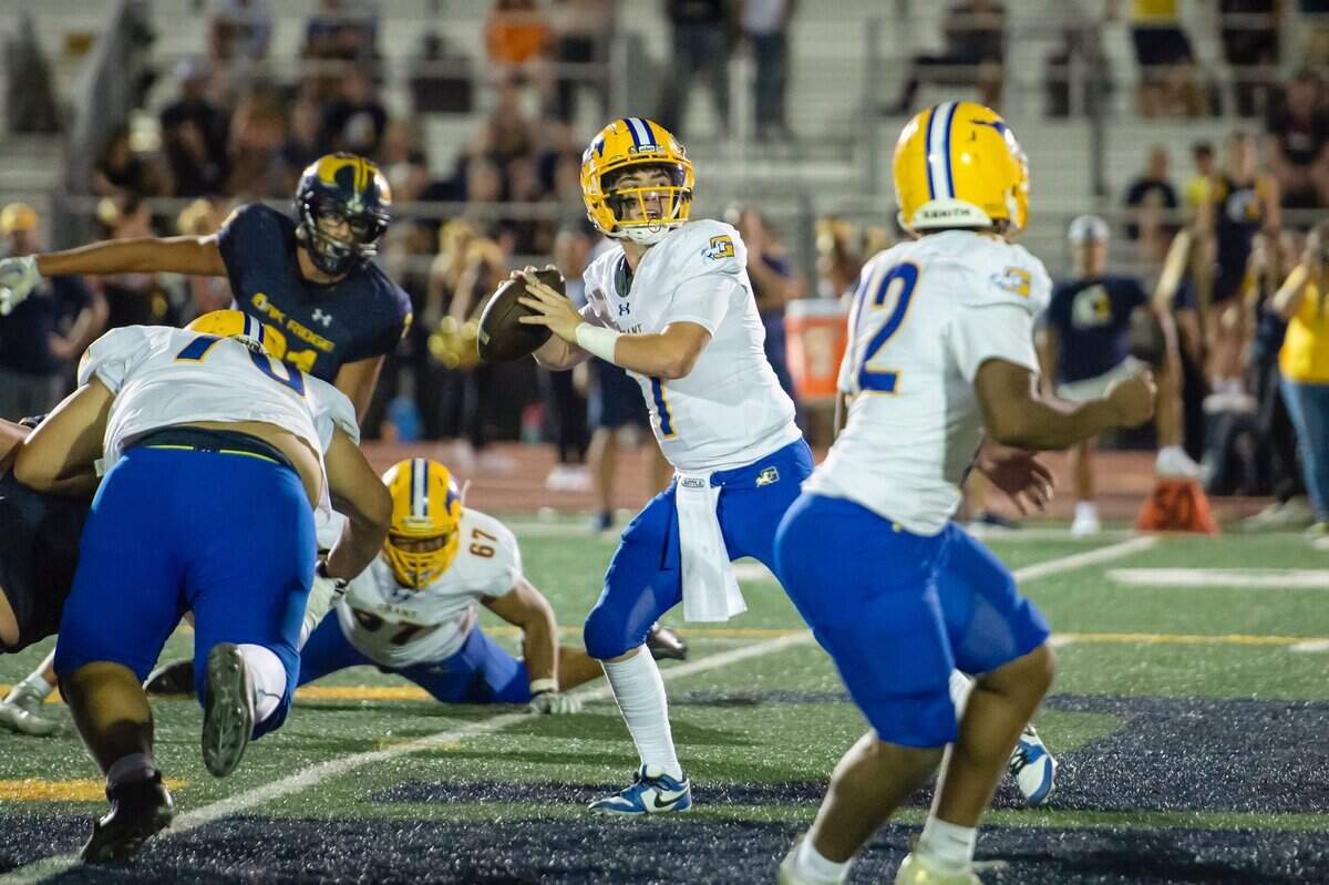 Grant Pacers quarterback Luke Alexander (7) looks to pass downfield in 2023 at Oak Ridge High School in El Dorado Hills.