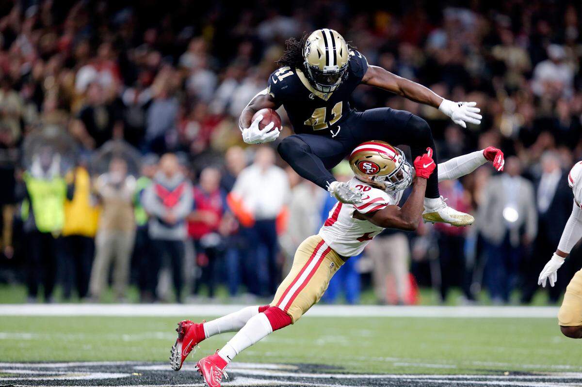 New Orleans Saints running back Alvin Kamara hurdles 49ers free safety Jimmie Ward during a game in New Orleans on Dec. 8, 2019.